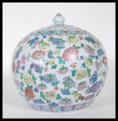 A polychrome enamel Chinese ginger jar of bulbous form, having floral decoration, geometric