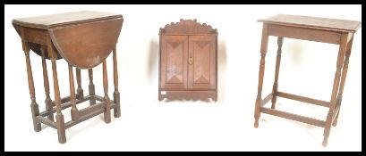 A 19th Century Victorian oak hanging box fitted with a single panel door together with an oak drop