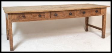 A very large 19th century Victorian country pine  plank top refectory dining table. Raised on