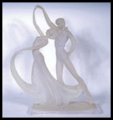 A 20th Century clear resin acrylic large figurine group depicting a dancing couple having stylised