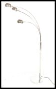 A vintage style atomic three point chrome floor lamp, circular base with chrome tubular upright