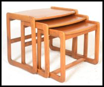A mid 20th century teak wood G-Plan graduating nest of tables in the Quadrille pattern. The tables