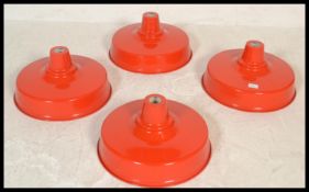 Light Shades - A group of four retro industrial factory style UFO form pendant lampshades having red