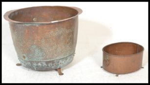 An early 19th century Victorian large copper pot, having rivets base detailing together with a
