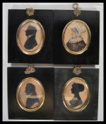 Three 18th / 19th Century Georgian framed and glazed silhouettes of two gentlemen and a lady set