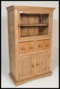 A 19th Century Victorian scrubbed pine pedestal cabinet / cupnard. Having singled glazed door to top