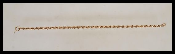 A ladies 9ct gold rope twist bracelet chain. Stamped 9k Italy uniting with a c-clasp. Length 7