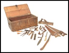 A selection of 20th Century tools to include, saws, knifes, spirit levels some bearing makers   mark