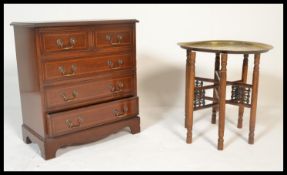 A reproduction Georgian style Regency revival chest of drawers, two over three drawers brass drop