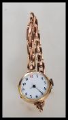 A hallmarked 9ct gold early 20th Century 9ct gold wrist watch having an expandable bracelet strap