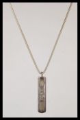 A 925 silver Tiffany & Co snake linked back chain and ingot pendant stamped T & CO 925. Chain