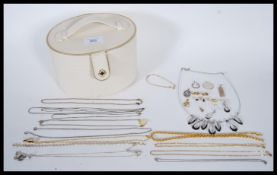 A collection of vintage costume jewellery to include vintage gold tone dress brooches, a silver