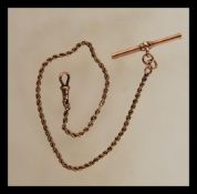 A stamped 9ct gold pocket watch fob chain having a rope twist chain with bar and toggle. Weight 5.
