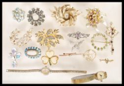 A collection of vintage costume jewellery to include a selection of 60's gold tone brooches,
