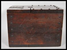 A 19th Century oak ballot / poor box having iron brackets and lock to the front,of riveted