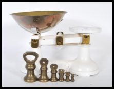 A pair of vintage early 20th Century shop / grocers scales having two brass plates and white painted