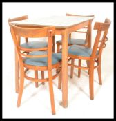 A vintage 1950's retro kitchenette dining suite to include table and chairs. The chairs having