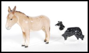 A vintage 20th Century Beswick ceramic figurine modelled as a Donkey stamped to the underside