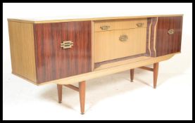 A vintage retro 20th Century two tone melamine sideboard / credenza, central bank of drawers flanked