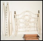 A contemporary Antique  Victorian style double bed frame with brass finials, painted  cream