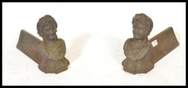 A pair of 19th Century French cast iron firedogs / chennets, the firedogs modelled as busts of ladys