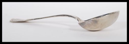 A 20th Century continental silver ladle of large form, having kings pattern handle. Stamped 800 to