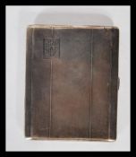 A vintage 20th Century Thomas William Lack silver hallmarked cigarette card having engine turned