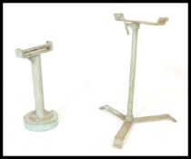 2 vintage early 20th century cast iron painted metamorphic trestle stands. Each in green colourway
