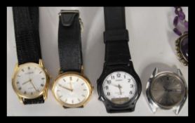 A collection of four retro 20th Century gents wrist watches to include two automatic Seiko watches