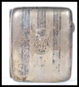 A early 20th Century silver hallmarked cigarette case, having engine turned decoration to front