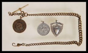 An early 20th Century watch fob chain together with a silver hallmarked fob medal with Birmingham