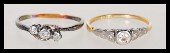 A hallmarked solitaire diamond 18ct gold platinum ring  together with another 18ct gold and platinum