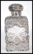 A 19th Century silver hallmarked mounted cut glass square decanter with star-cut sides and base by