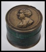 Politics - a 19th Century circular ebony and medallic snuff box, commemorating the life of Charles