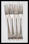 A set of four Thomas Wilkes Barker silver Georgian forks being hallmarked for 1807. Weight 132.2g.