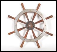 A vintage early 20th century teak wood & steel rim eight spoke ship's wheel.Measures 37cm wide.