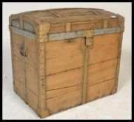 A 19th Century Victorian wooden bound dome top travel trunk,, hinged top with latches to the