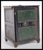 A 19th Century Victorian cast iron novelty money box in the form of safe, having been painted in