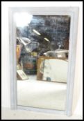 A vintage 20th Century large wall mirror, the frame having a later painted distressed finish with