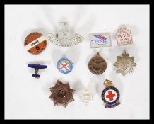 A collection of vintage 20th Century badges to include, an enamel National League of Airmen,