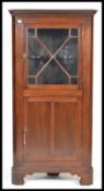 An early 20th Century mahogany Edwardian corner ca