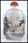 A 20th Century Chinese glass reverse painted snuff bottle of large proportions having hand painted