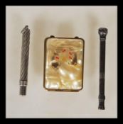 A vintage 20th Century silver white metal propelling pencil having engraved decoration and set