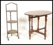 An early 20th Century Anglo-Persian - Islamic inspired three tier metamorphic oak framed cake stand,