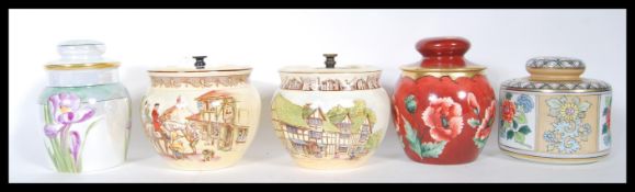 A collection of 20th Century tobacco jars and lids to include a luster floral design marks M Z