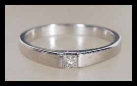 A 9ct white gold single stone diamond ring. Hallmarked to the shank, single stone princess cut