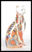 A Royal Crown Derby Imari paperweight in the form of a Siamese cat, dated MMI for 2001, gold stopper