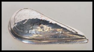 A 20th Century silver on copper novelty snuff/ pill box in the form of a mussel with hammered
