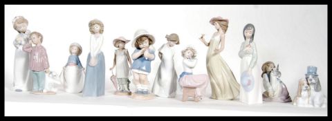 A collection of twelve ( 12 ) Nao ceramic figures to include, 'It's a picnic' no. 01362, 'Gentle