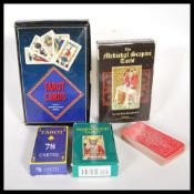 A collection of five sets of Tarot cards to include a boxed Medieval Scampini, another set with